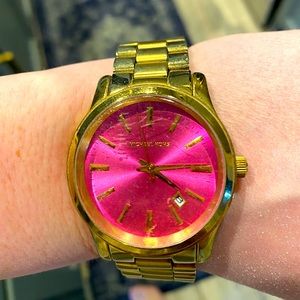 Michael Kors pink faced watch.